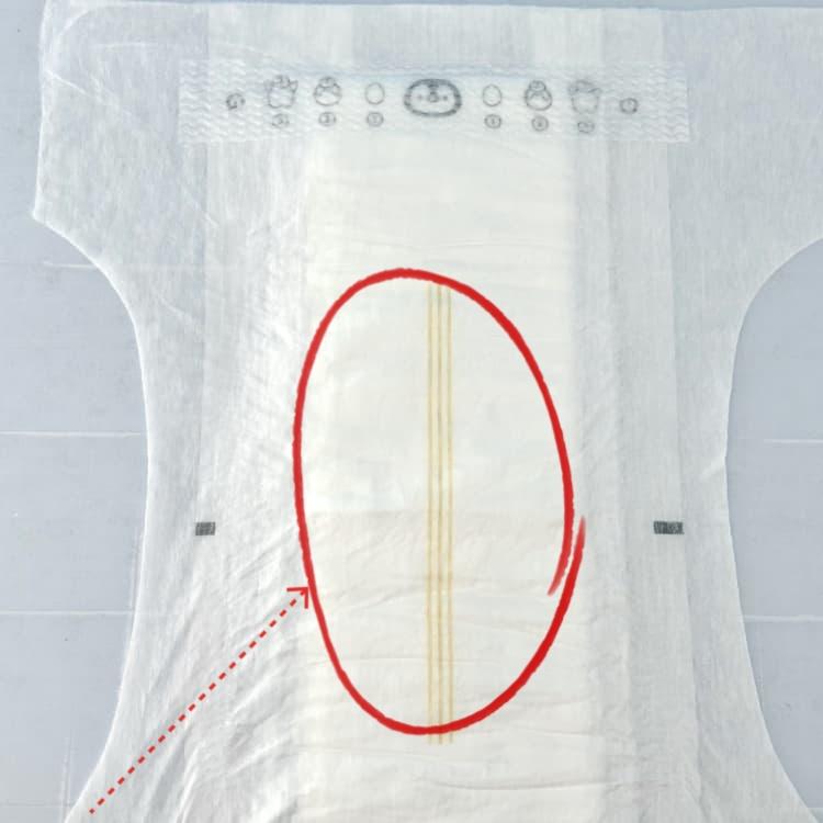 Wetness indicator adhesive